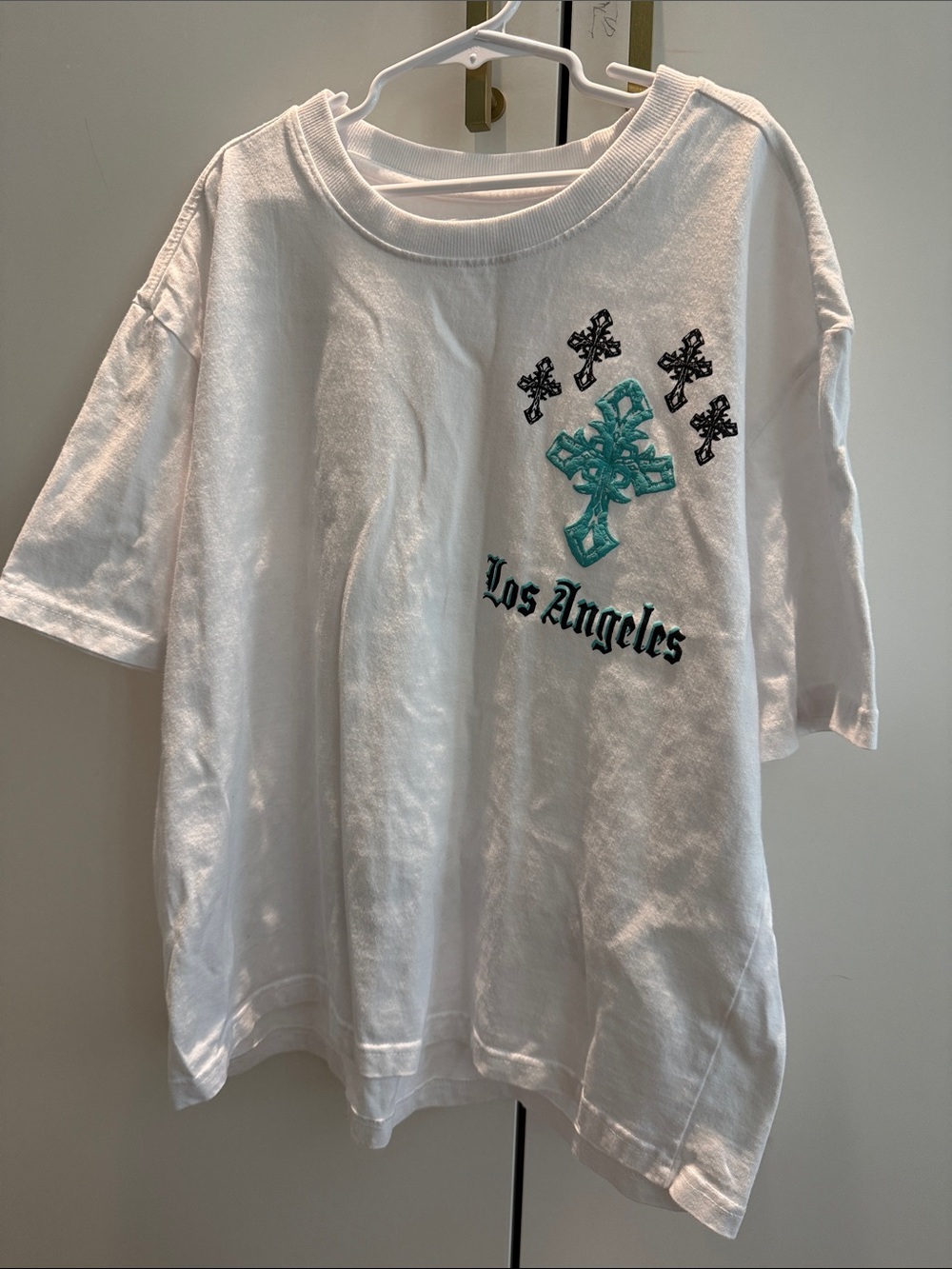 White Kids Short Sleeve Tee with Teal Cross Graphic